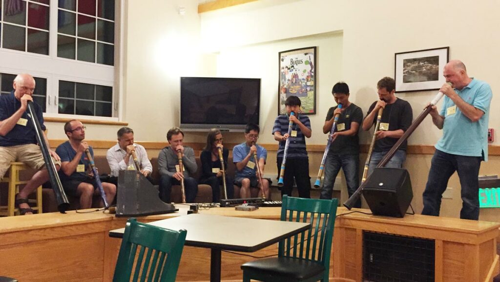 Graham Wiggins leading a didgeridoo workshop for researchers at the Gordon conference in 2016.