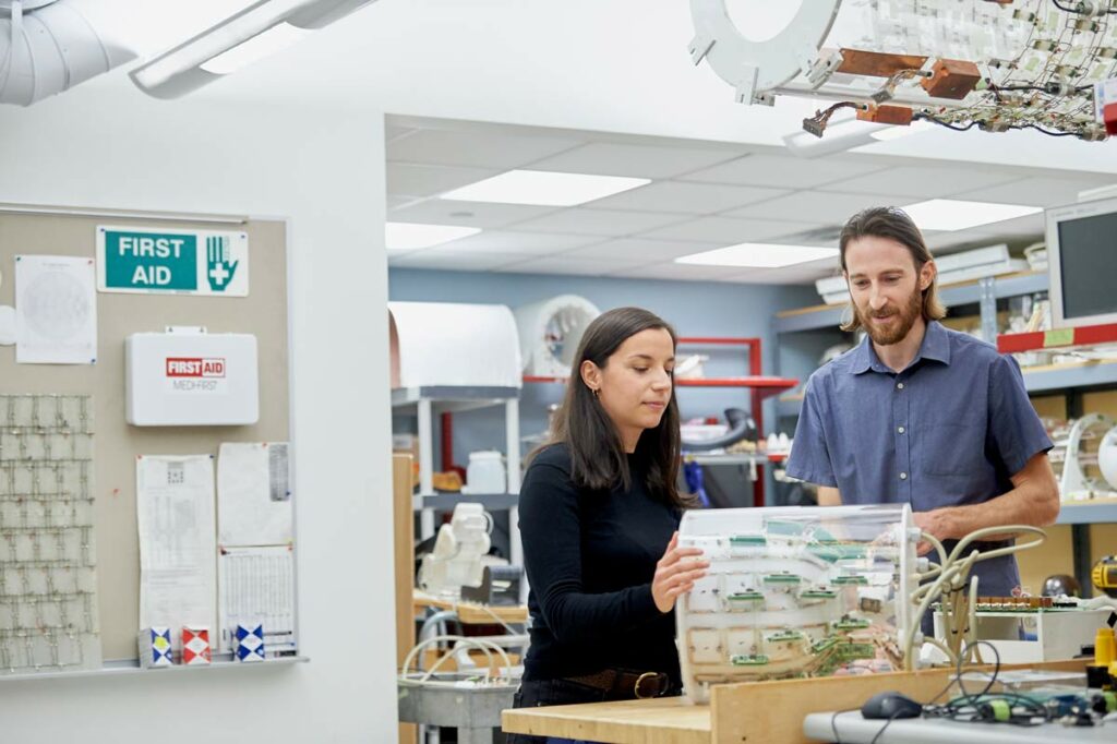 Photograph of Carlotta Ianniello and Ryan Brown in NYU Langone's radiofrequency (RF) laboratory.