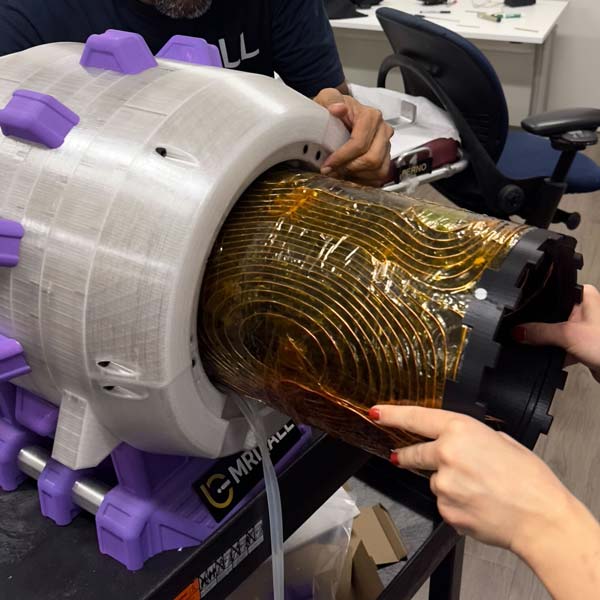 Gradient coils seen being inserted into the magnet.