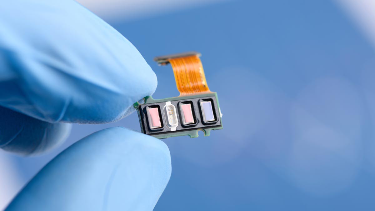 Photo: close-up of a sensor array from a smart watch fitness tracker.