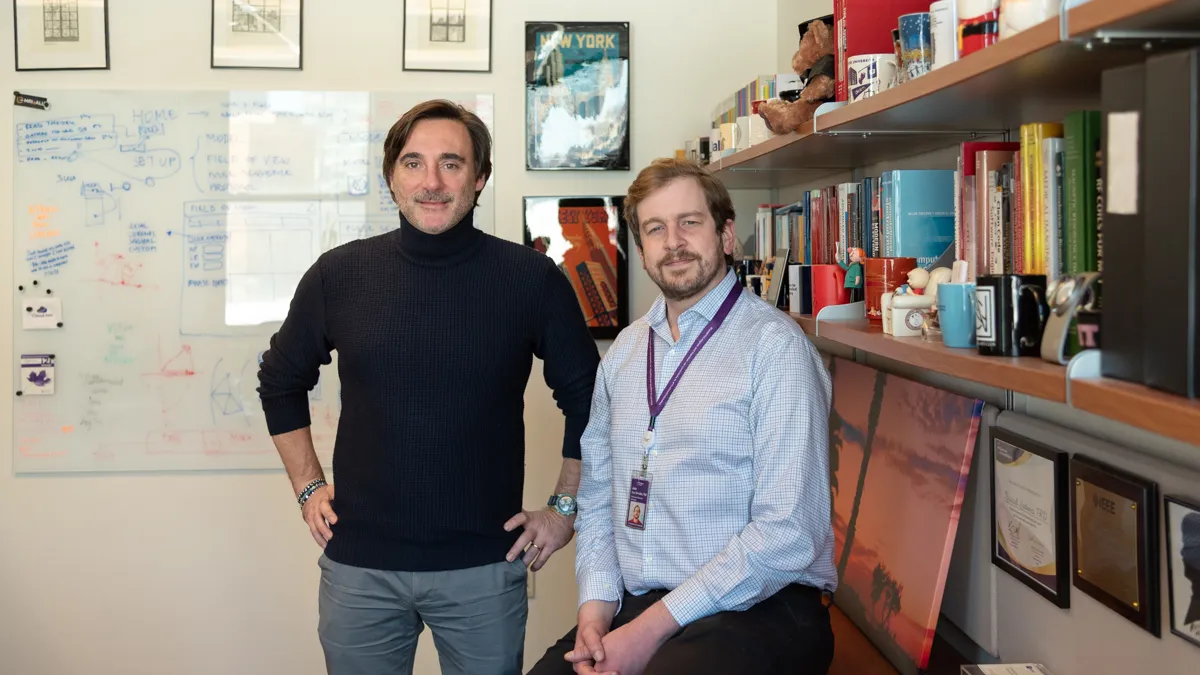 Photo of Riccardo Lattanzi and José Cruz Serrallés in an office.