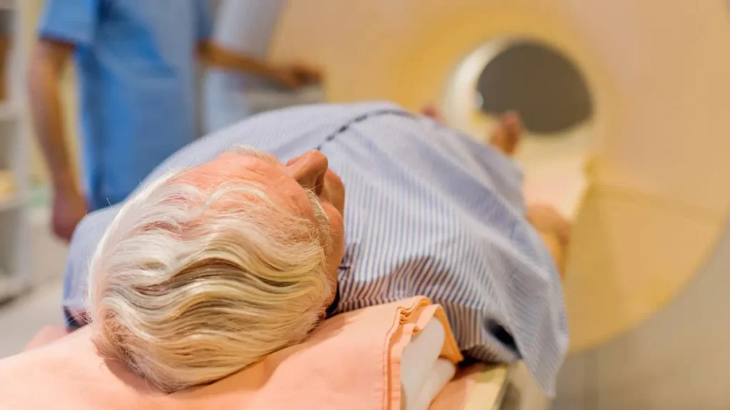 Photo of patient on a scanner bed.