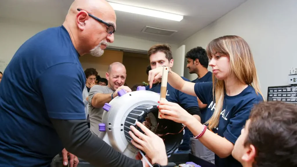 Photo: researchers assembling a tabletop MRI scanner.
