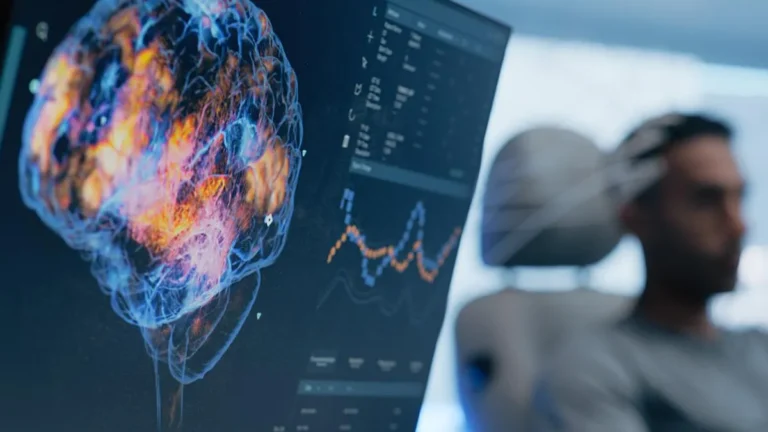 Illustration: brain image on a screen with a person wearing head probes in the background.